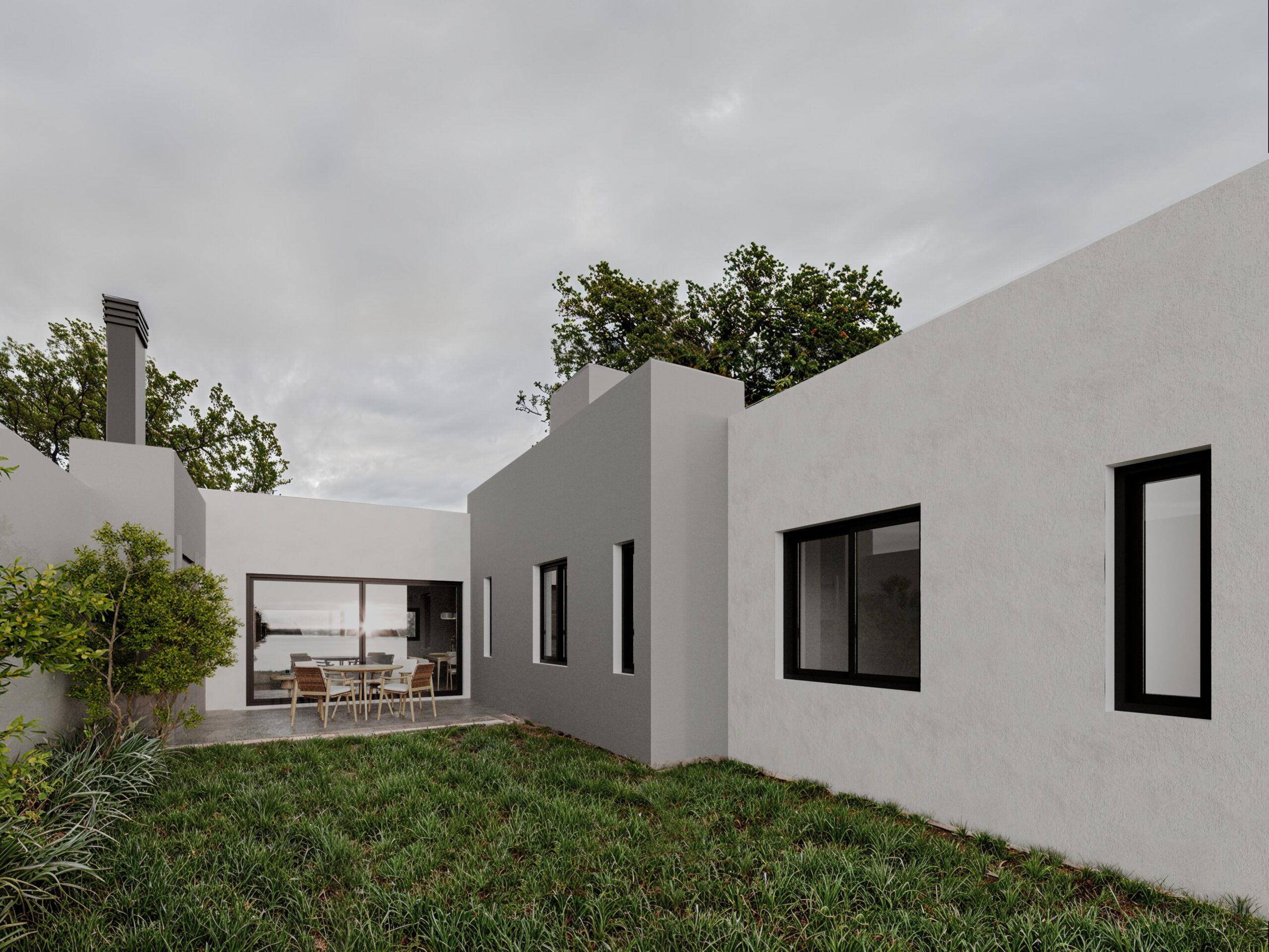 patio-trasero-rozio Patio trasero parquizado con galería y asador en vivienda unifamiliar - Proyecto Rozio