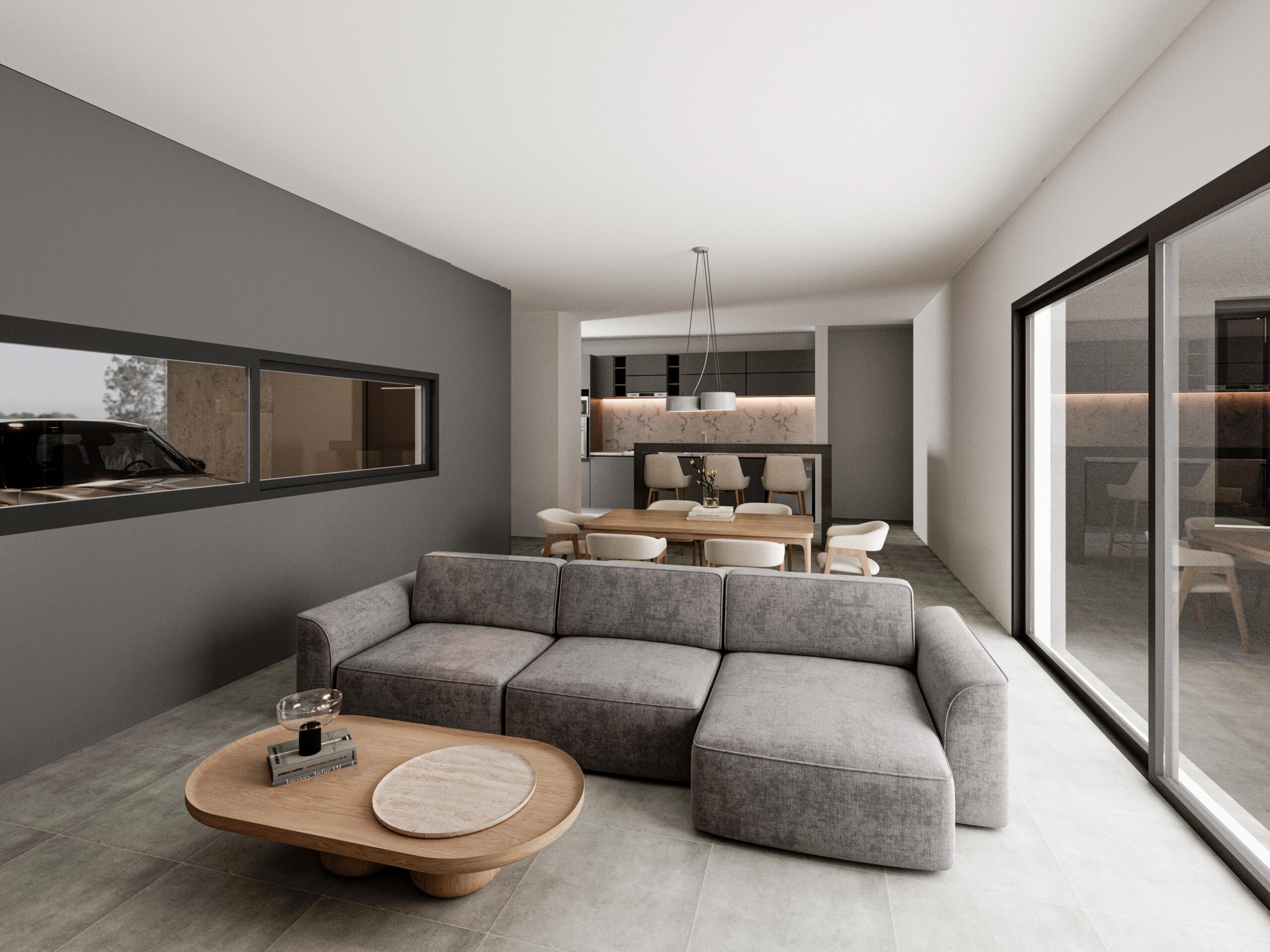 salon-rozio-docta Estar principal con ventanal hacia el patio - Vivienda Rozio en Barrio Docta